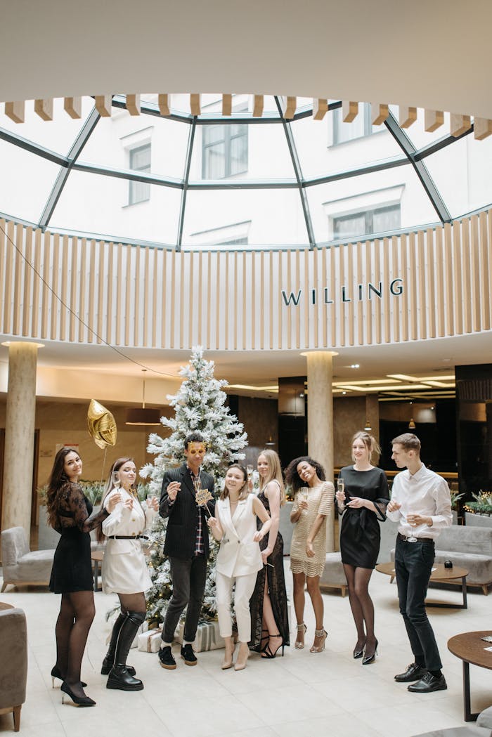 A stylish group celebrating indoors with a festive atmosphere, elegance, and holiday spirit.